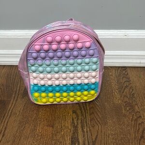 Pop it back pack multi colored glittery